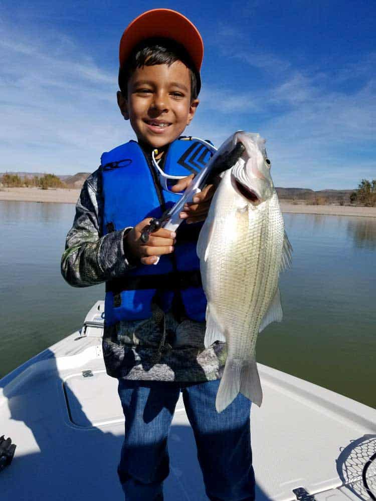 Azariah fishing at elephant butte lake state park.