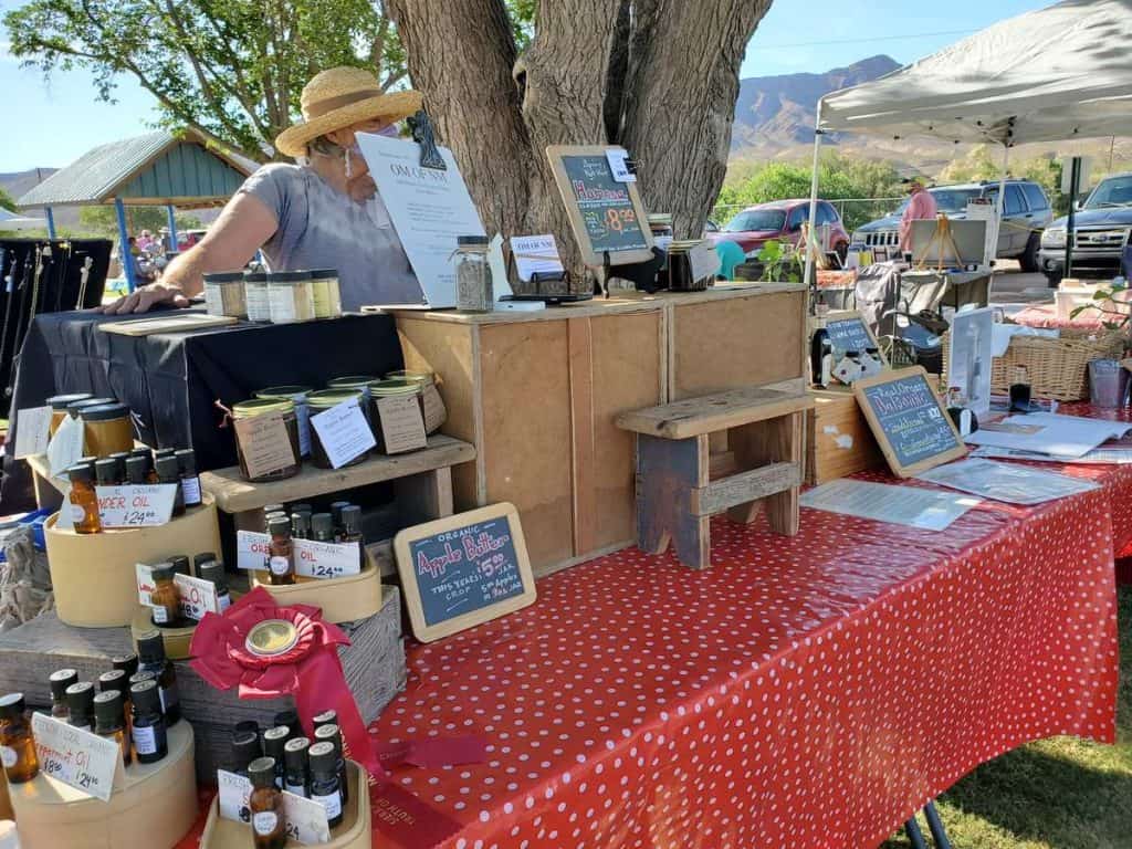 old monticello organic farms booth at the sierra county farmers market