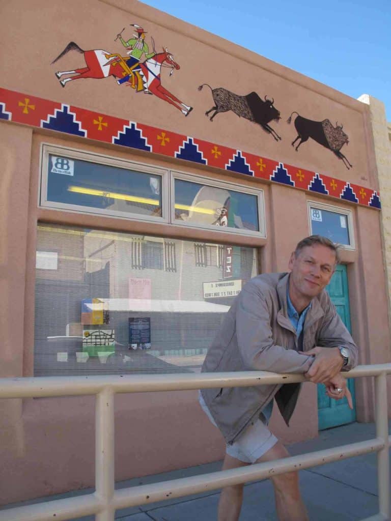 peter bowles with his mural on main