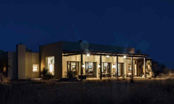 the hacienda at armendaris ranch house at night