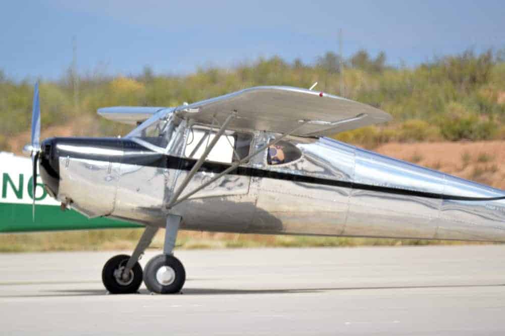 an aluminum airplane at a spaceport america open house